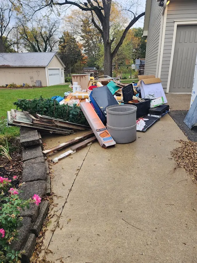 Dumpster being loaded with debris for 3 Yard Dumpster Rental in Silverdale